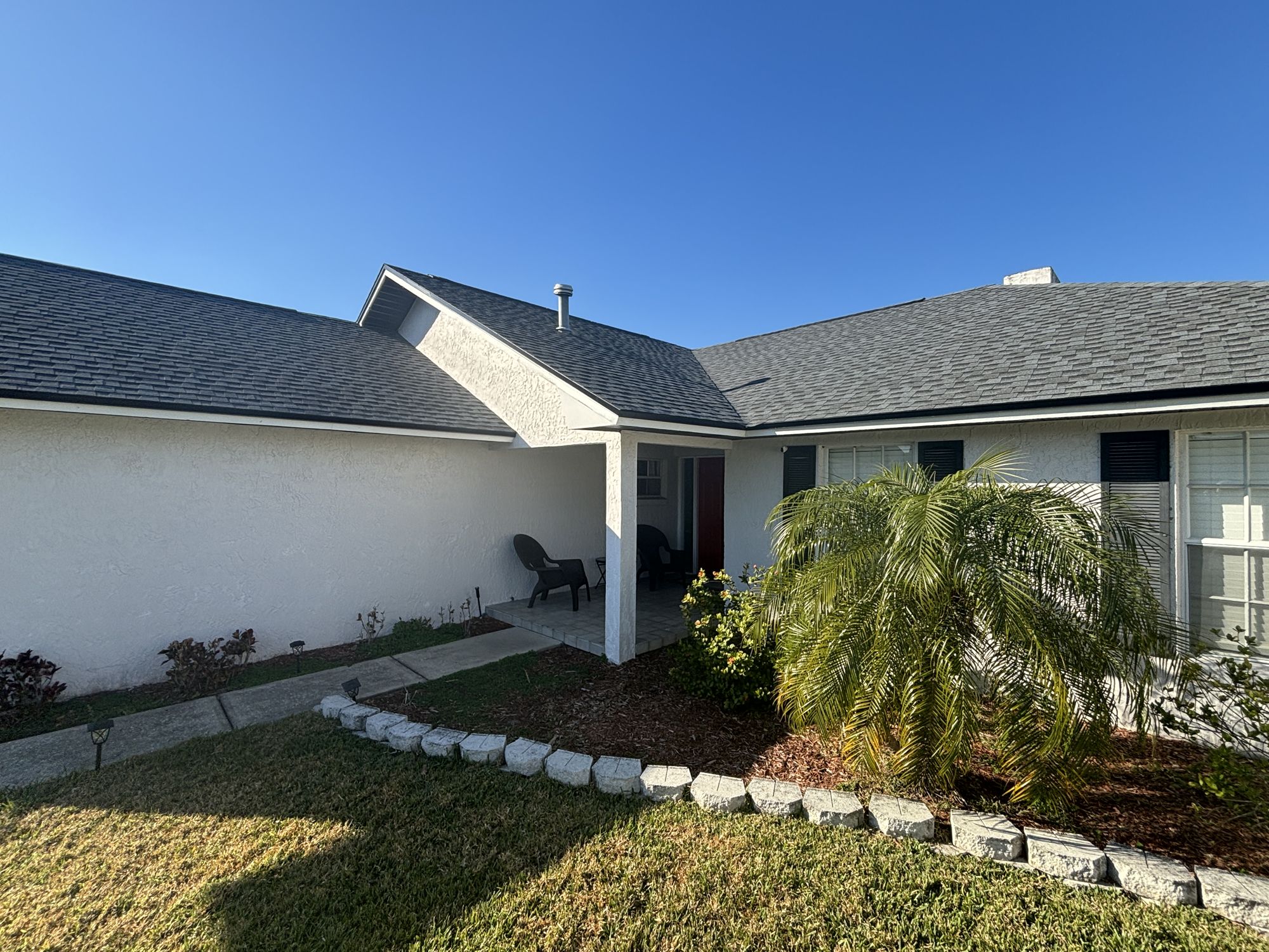 New architectural shingle roof on a single-story home